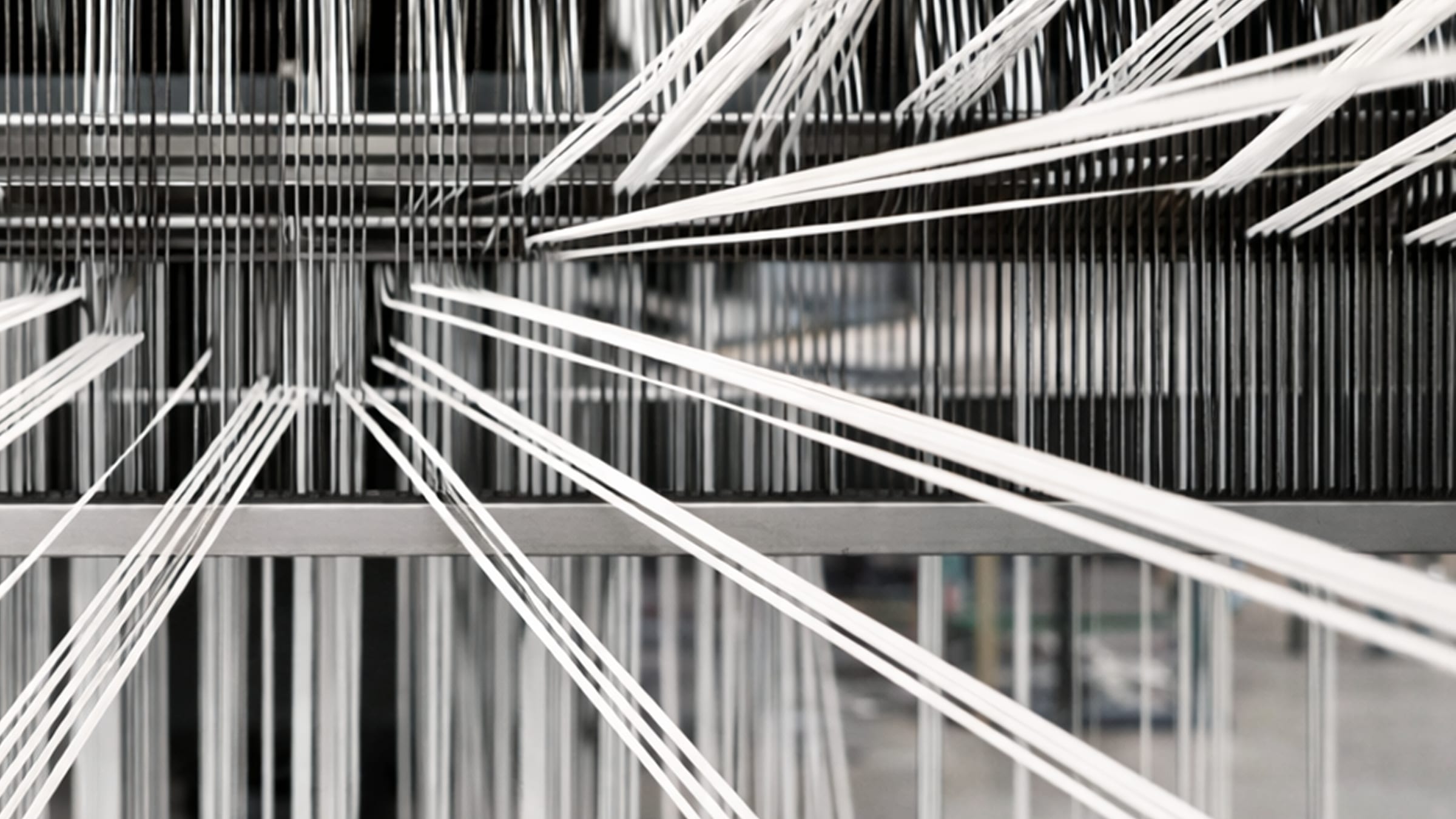 Warp lines threaded through the creel on a JP Extrusiontech tape line